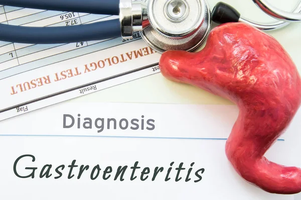 Model of stomach, blood test and stethoscope lying next to written title on paper diagnosis Gastroenteritis. Concept photo of causes, diagnostic, treatment and prevention of Gastroenteritis — Stock Photo, Image