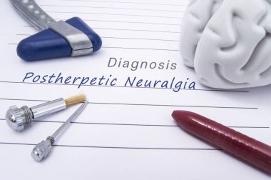 Figure of human brain, blue neurological reflex hammer, neurological needle and brush for test sensitivity and ballpoint pen lie on paper form with a medical diagnosis of Postherpetic Neuralgia (PHN) clipart