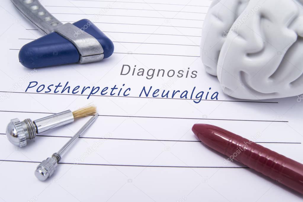 Figure of human brain, blue neurological reflex hammer, neurological needle and brush for test sensitivity and ballpoint pen lie on paper form with a medical diagnosis of Postherpetic Neuralgia (PHN)