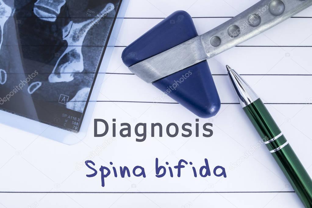 Diagnosis of Spina Bifida. Medical health history written with diagnosis of Spina Bifida, MRI image sacral spine and neurological hammer. Medical concept for Neurology, Neuroscience, Neurosurgery