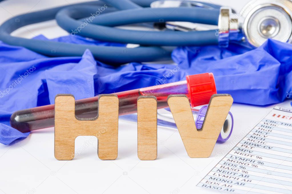 HIV abbreviation or acronym for medical concept, laboratory detection or diagnosis of human immunodeficiency virus or virus that causes AIDS. Word HIV amid lab test tubes with blood and stethoscope 