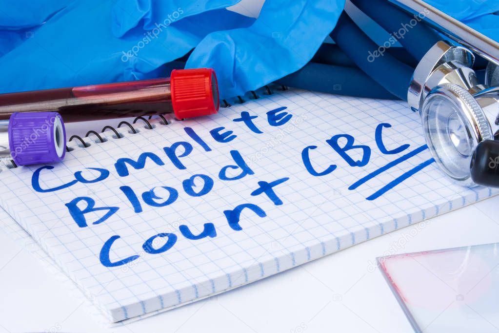 Complete Blood Count (CBC) test procedure. Laboratory test tubes with blood, stethoscope and gloves are near note with text Complete Blood Count (CBC) on table in doctor Office. Use test in diagnosis