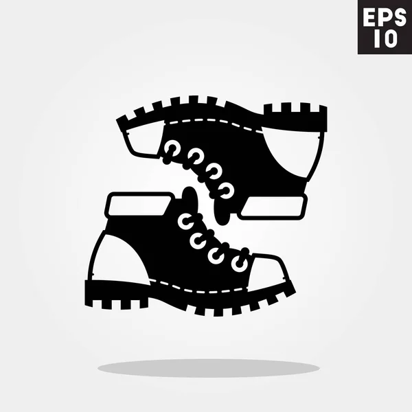 Icône de chaussures de montagne dans un style plat tendance isolé sur fond gris. Symbole de camping pour votre design, logo, UI. Illustration vectorielle, EPS10 . — Image vectorielle