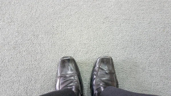 Business man on the carpet floor with copyspace — Stock Photo, Image