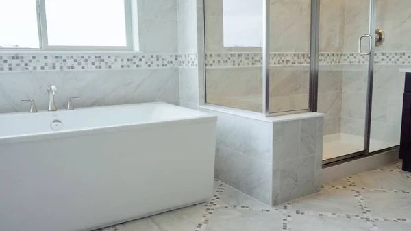 Modern master bathroom in luxury home.