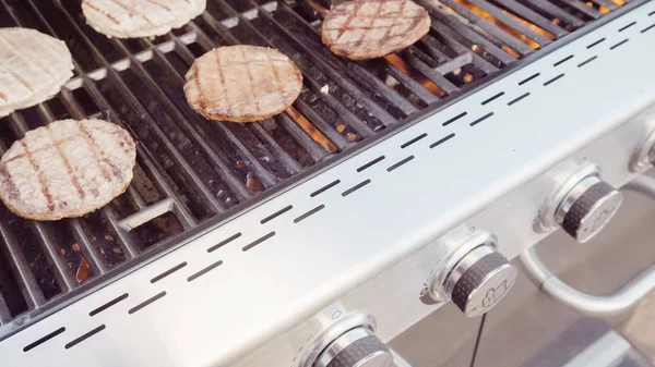 Burgers on grill view — Stock Photo, Image