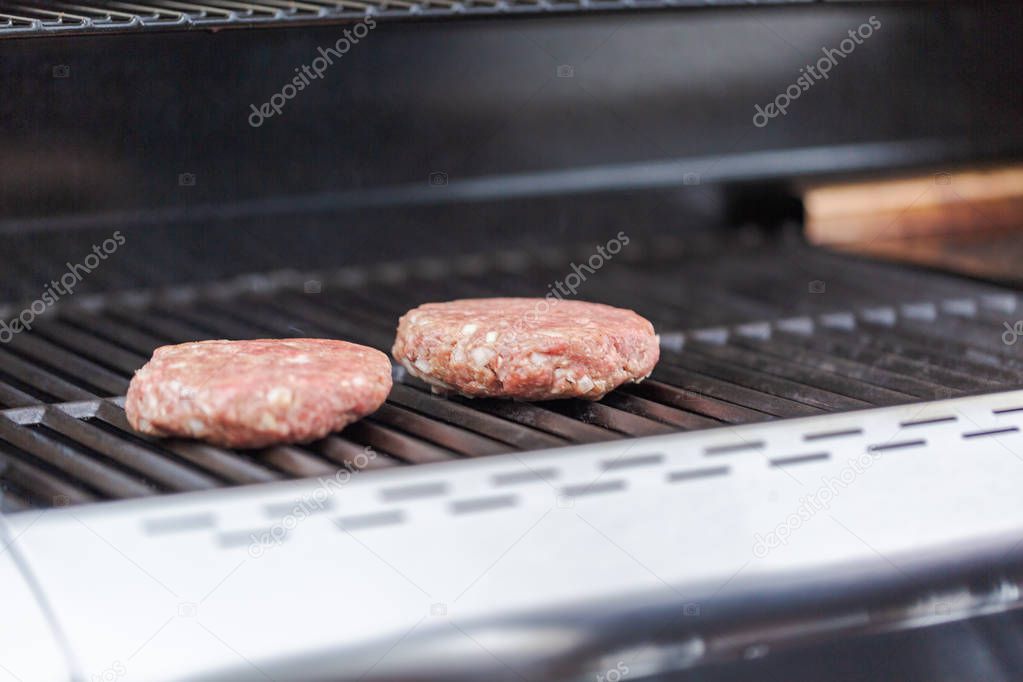 Cooking classic burgers outdoor