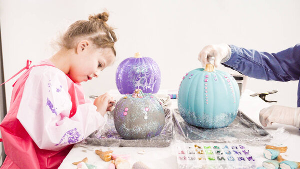Decorating mermaid pumpkins
