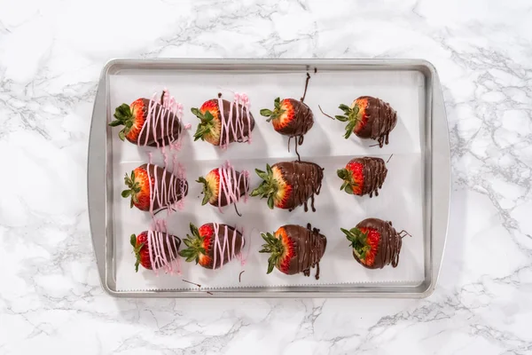 Flat lay. Chocolate dipped strawberries drizzled with melted chocolate.