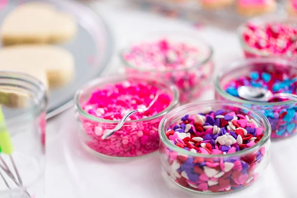 Variety Pink Sprinkles Decorating Valentine Day Cookies — стоковое фото