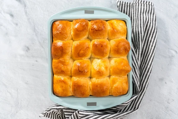 Flat lay. Freshly baked dinner rolls in the baking pan.