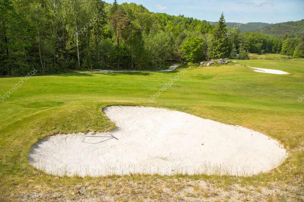 Sand trap in a golf course sand bunkers heart shape