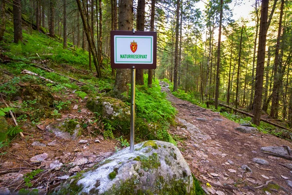 Nature reserve sign in the forest in Tovdal. Norwegian landscape.
