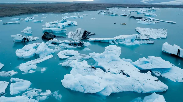 Aerial over icebergs floating in Jokulsarlon Lagoon by the southern coast of Iceland