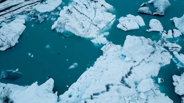 Aerial over icebergs floating in Jokulsarlon Lagoon by the southern coast of Iceland