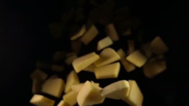 The pumpkin falls into the air on a black background. Slow motion. — Stock Video