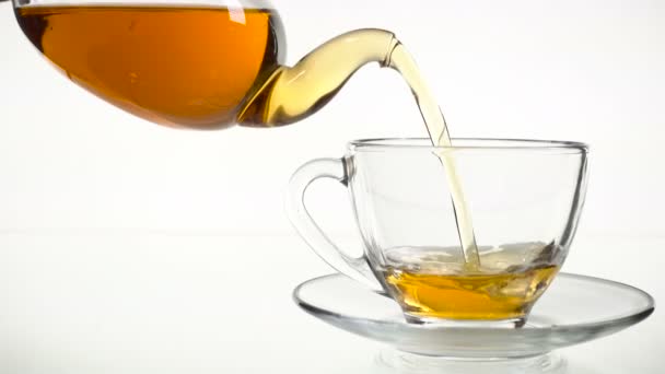 Tea being poured into glass tea cup — Stock Video