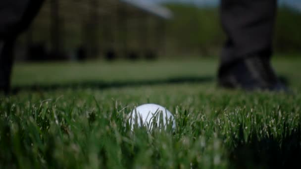 Golf club hitting ball on the green artificial grass in slow motion — Stock Video