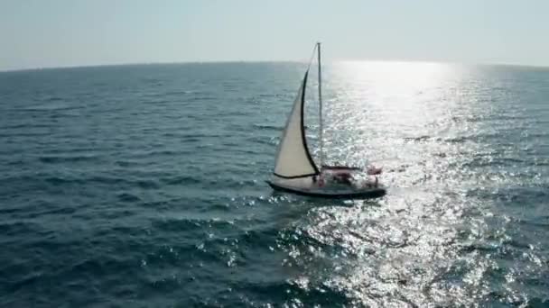 Yacht sailing on opened sea. Sailing boat. Yacht from drone. Yachting video. Yacht from above. Sailboat from drone. Sailing video. Yachting at windy day. Yacht. Sailboat. — Stock Video