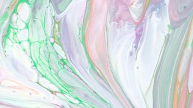 Soyut psikedelik arka plan. Renkli boyalar sütte yavaşça desenlere dökülür.