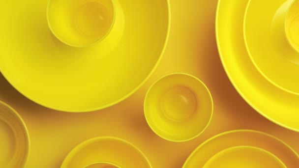 Abstract yellow plastic bowls layers background — Stok video