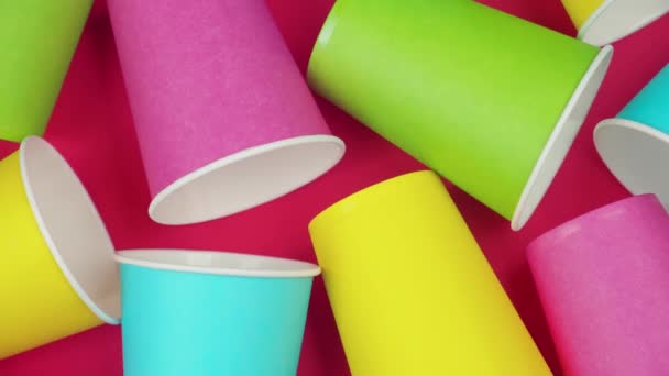 Flat lay multicolored paper cups. background Red color — Stock Video