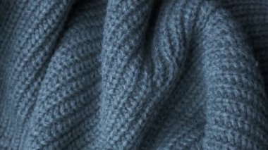 Örgü yün arka planı. Gerçek yün elbise dokusu yakından, doli atış. Yumuşak gri merino yün makro atış. Yünlü kumaş. Örgü kumaş..