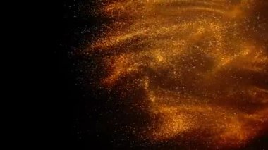 Sudaki altın mürekkep kamerayla çekiliyor. Altın boya damlaları düşer, reaksiyona girer, siyah üzerine soyut bulut oluşumları yaratır. Sanat arkaplanı.
