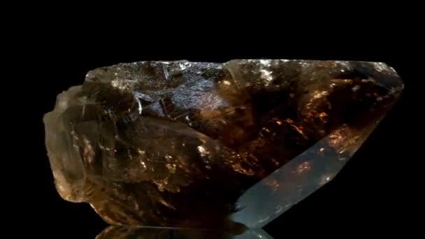 Smoky quartz mineral rock gem stone quartz geology specimen, quartz rotates on a black background — Stock Video