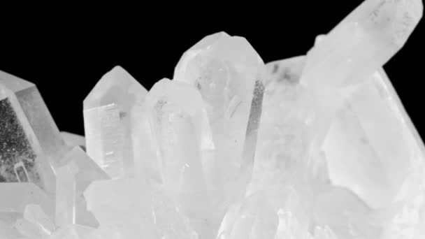 Transparent white quartz crystal . Rotates on a black background. Macro — Stock Video