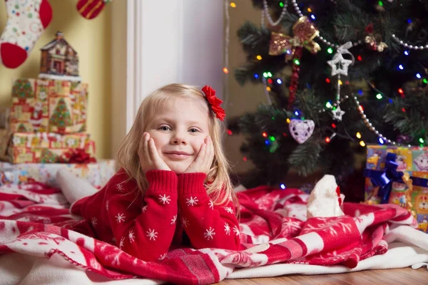 Happy little girl  under the Christmas tree — Stock Photo, Image