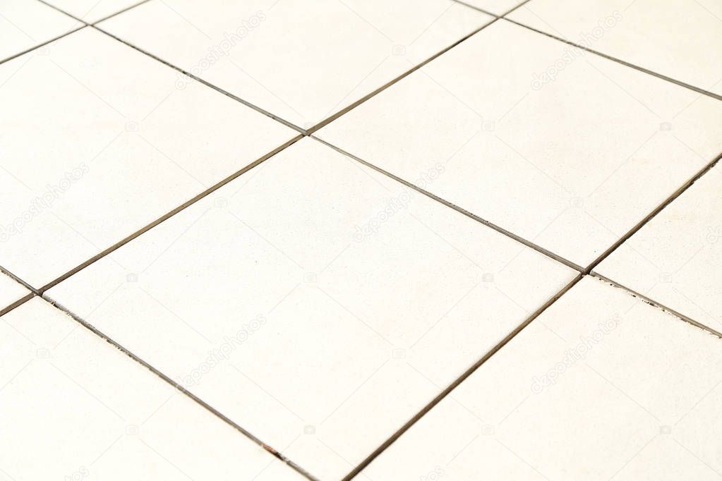 Light  tile on the floor.