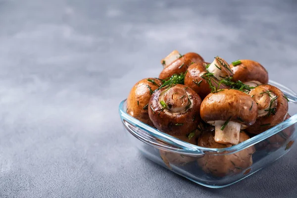 Champignon mushrooms marinated with olive oil and fennel ready to cook. Mushrooms reday to bbq. Text space