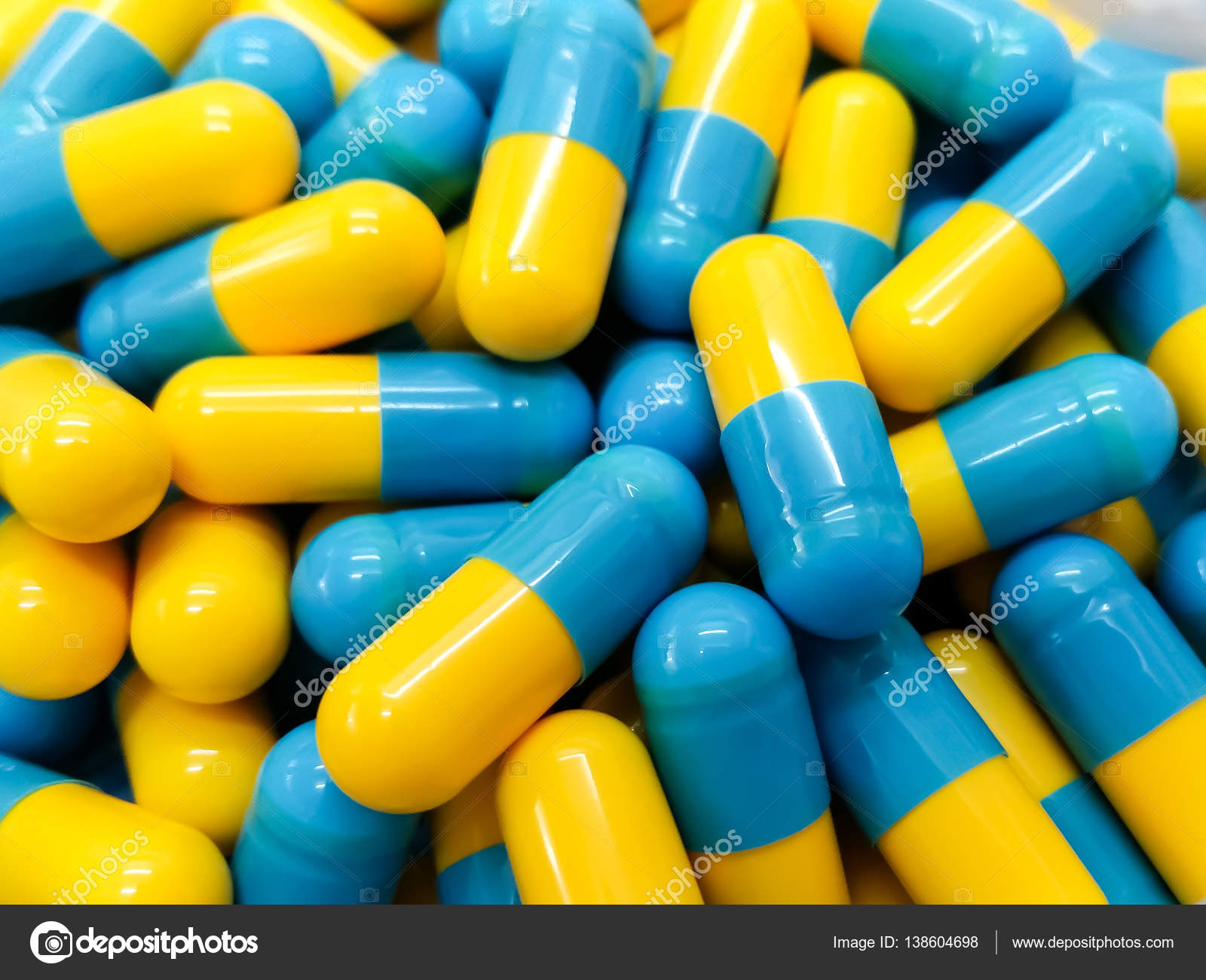 Two tone Medicine Capsules on Stainless Steel drug tray, Yellow Pills