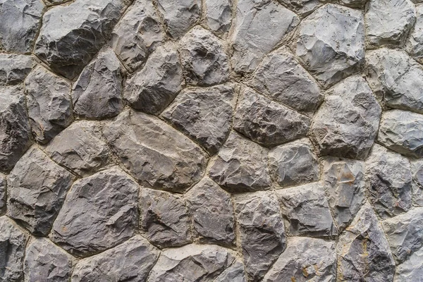 Pierre brute de différentes nuances, Mur en pierre empilée — Photo