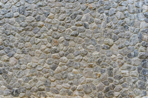 Piedra áspera de diferentes tonos, pared de piedra apilada Imagen de archivo