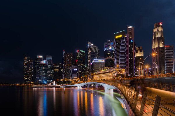 Singapore, Singapore - April 14, 2017: Singapore skyline and illuminated financial district night view, Downtown Urban cityscape of Singapore. Modern skyscrapers of business district Marina Bay