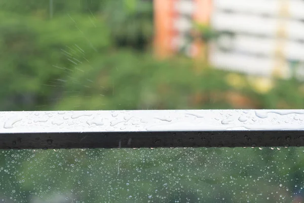 Rain drops on glass balcony, rainy day and apartment — Stock Photo, Image