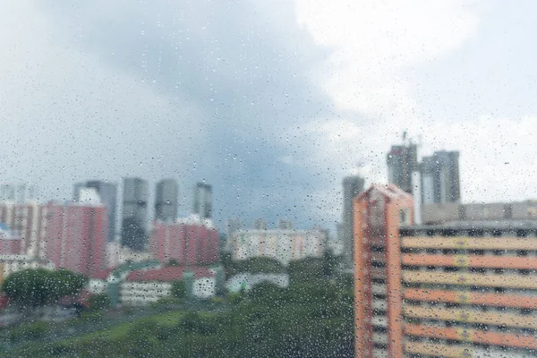 Rain drops on window, rainy day and apartment urban scene — Stock Photo, Image