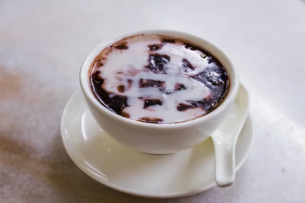 Singapore dessert called Bubur Pulut Hitam, Black Sticky Rice De