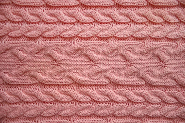 Pletená textura modré vlněné pletené textilie s copánkovým vzorem. — Stock fotografie