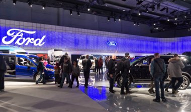 Toronto, Canada - 2018-02-19: Visitors of 2018 Canadian International AutoShow on Ford Motor Company exposition clipart