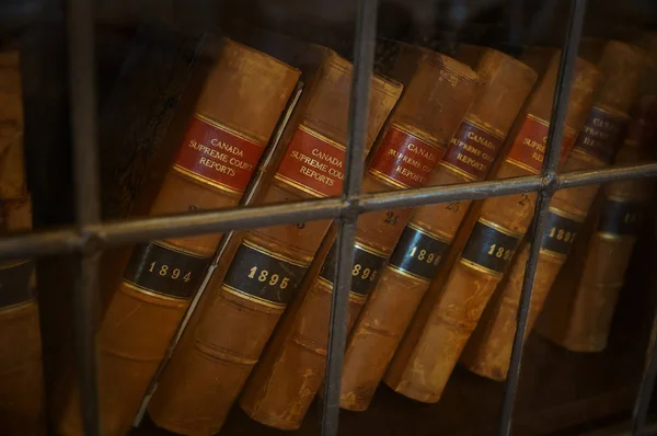 TORONTO, CANADA - 06 20 2016: Antique volumes Canada Supreme Court Reports in the exposition of Casa Loma, famous museum in a Gothic Revival castle built in 1914 at the centre of Toronto city.