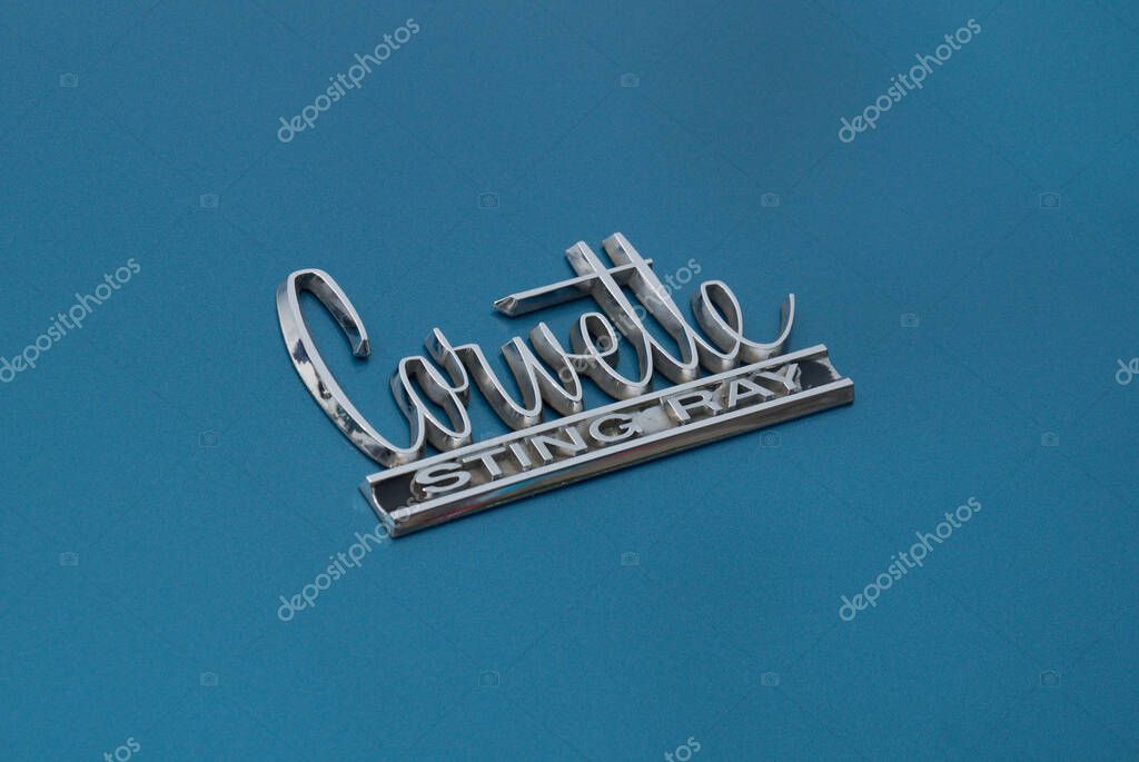 TORONTO, CANADA - 08 18 2018: Chevrolet Corvette Sting Ray emblem on the trunk of blue oldtimer car on display at auto show Wheels on the Danforth.