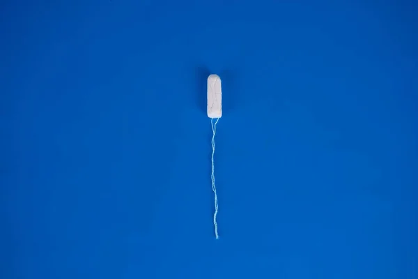 Womens health and medicine - tampons on a blue background — Stock Photo, Image