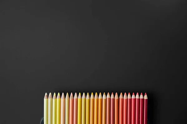 Color pencils on a black background — Stock Photo, Image