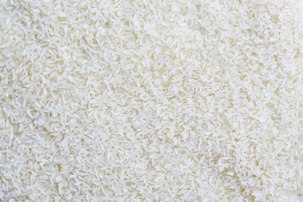 Taneli pirinç. Gümüş, beyaz arka plan ve doku.
