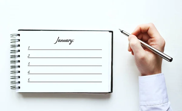 Notebook  business records. January plan — Stock Photo, Image