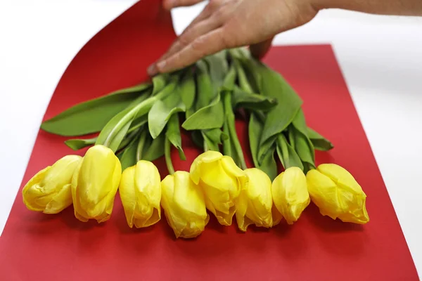 Flowers on the table. Packaging colors. Tulips