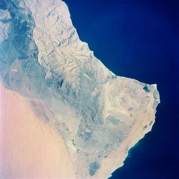 View of the southeastern tip of the Arabian Peninsula with the Gulf of Oman at upper right. elements of this image furnished by nasa